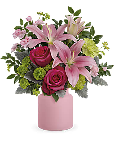 Pink lilies and roses in a pink vase