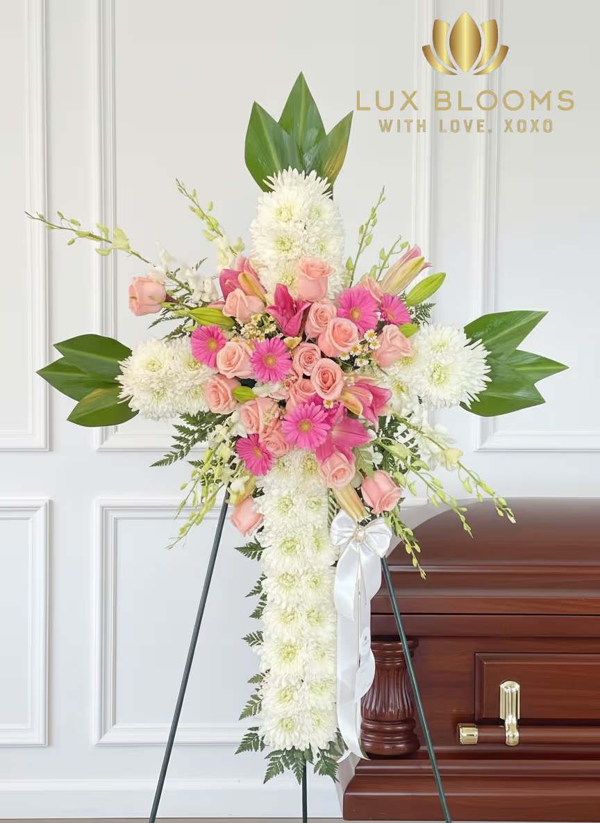 Standing floral spray with pink roses and white chrysanthemums on an easel