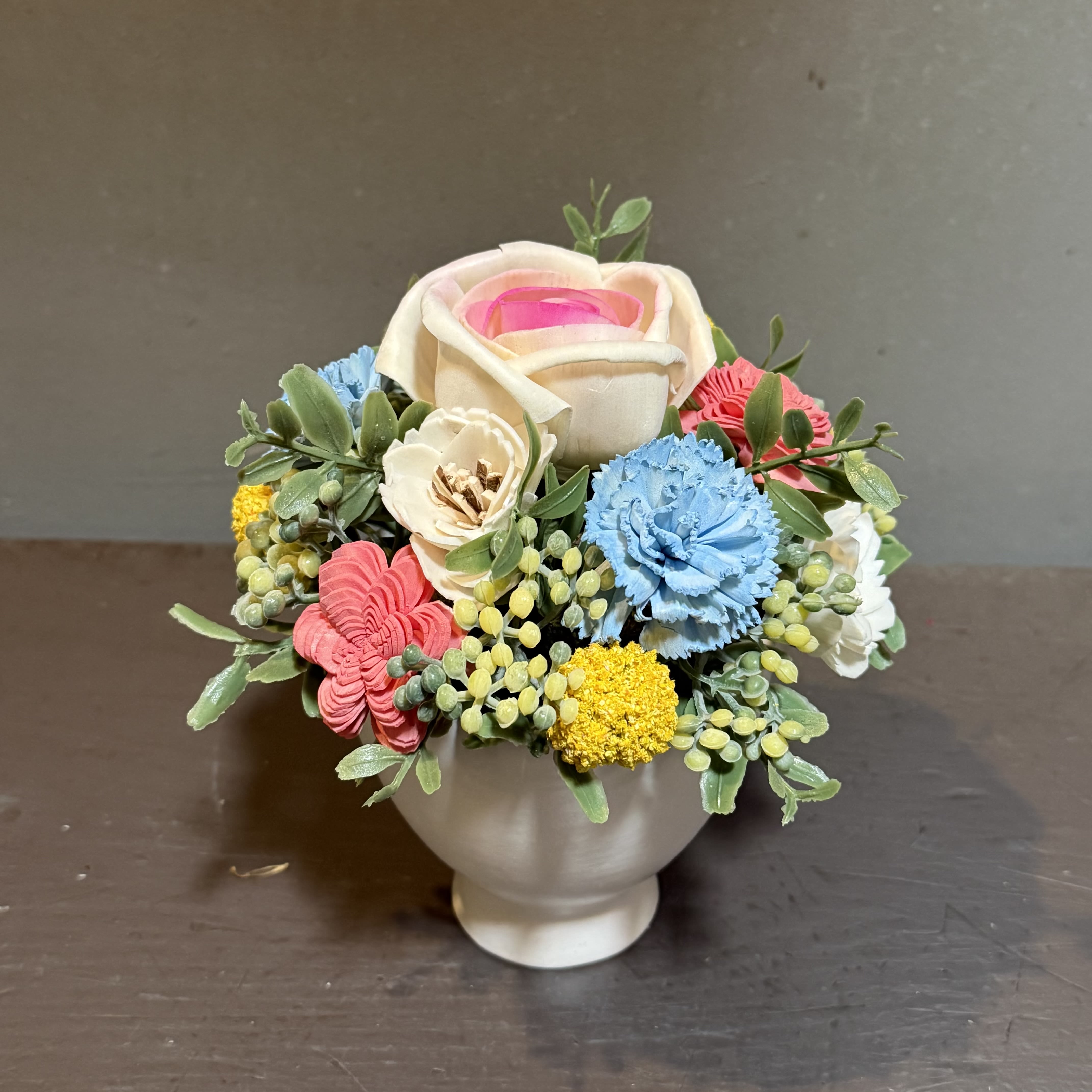 Sola Wooden Flower Centerpiece - Soft Pink Rose Garden - Hand-crafted and hand-dyed by us, these flowers made of balsa wood are a wonderful everlasting floral arrangement - great for those with allergies! Can be used as a natural essential oil diffuser too!    Arrives in a keepsake ceramic vase and designed to look like our best selling Rose Garden. Approx. Dimensions: 7"Tx6"W 