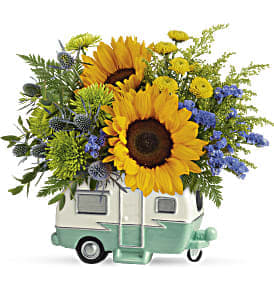 Sunflower bouquet in a small camper-shaped container