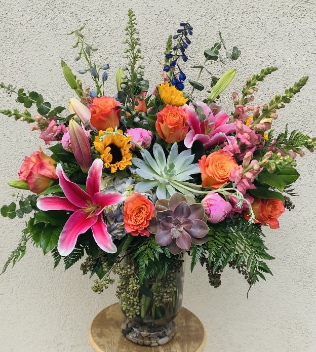 Floral Garden Bouquet - A large mix of seasonal bright flowers with succulents and mixed greens.
