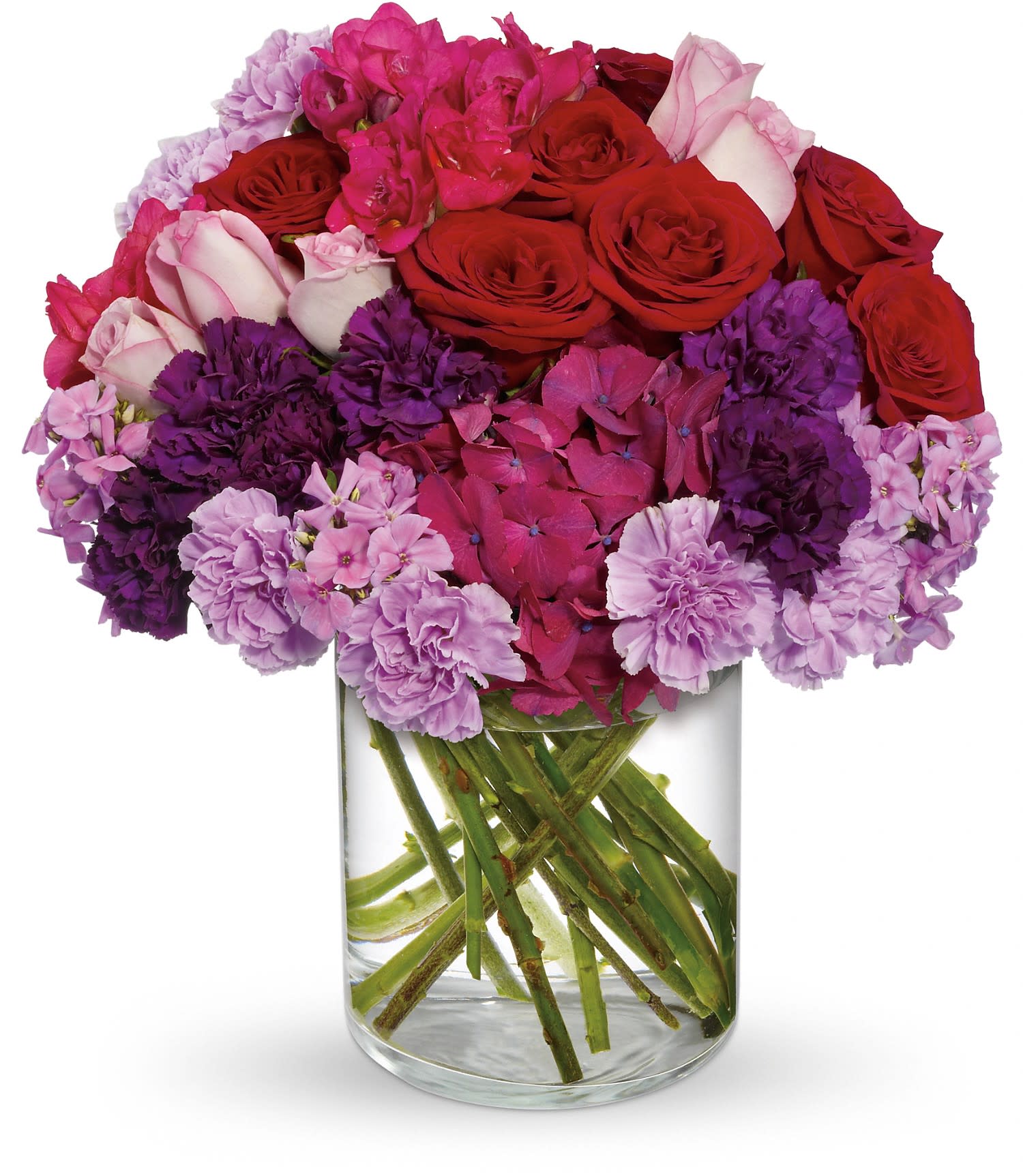 Roman Holiday by Teleflora - Want to know the true meaning of a Roman Holiday? If you ask us, it's really a "romance" holiday where true love blossoms! In this case, it's presented gorgeously.  Beautiful dark pink hydrangea, red and lavender roses, carnations in dark purple and lavender, hot pink freesia and lavender phlox are perfectly arranged in a simply lovely cylinder vase. Happy holiday!  Approximately 12" W x 14" H  Orientation: All-Around      As Shown : T10-1A     Deluxe : T10-1B     Premium : T10-1C  