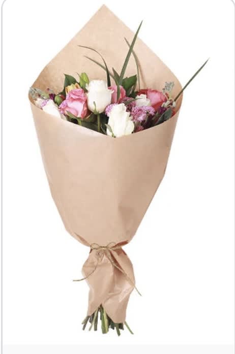 Wrapped Bouquet - A beautiful mix of spring flowers hand tied and wrapped in craft paper