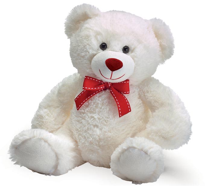 White teddy bear with a red bow on a plain background