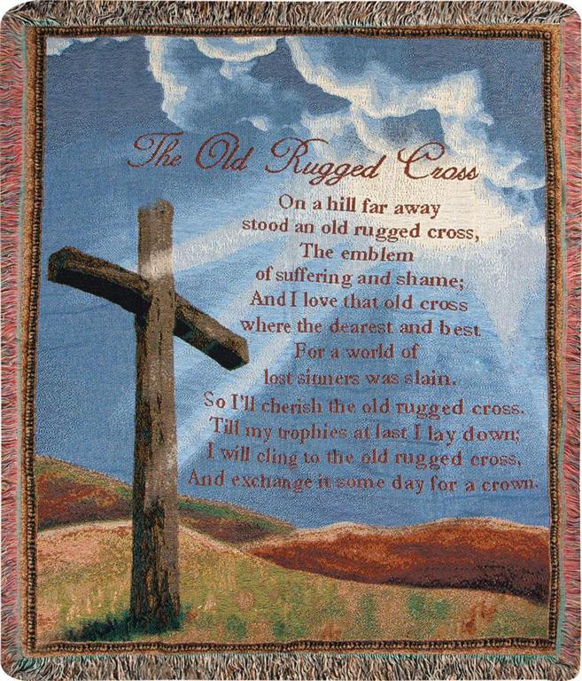 Tapestry with a wooden cross and printed poem against a blue sky