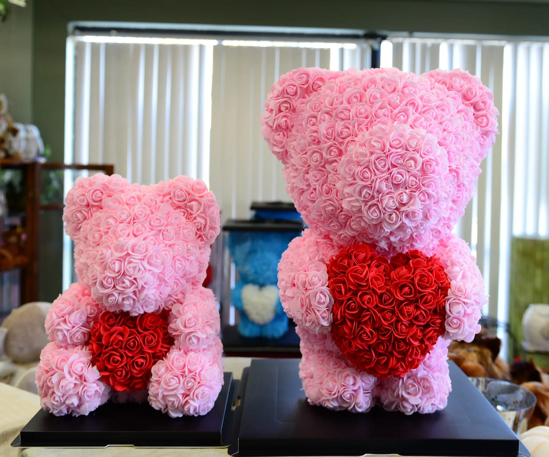 Pink Rose bear - These gorgeous Teddy bear are made of soft synthetic fabric roses in romantic color. They  come in a clear gift box.  This bear is a great gift by itself or you can add a flower arrangement with it.  standard: 14" bear deluxe: 20" bear (out of stock)