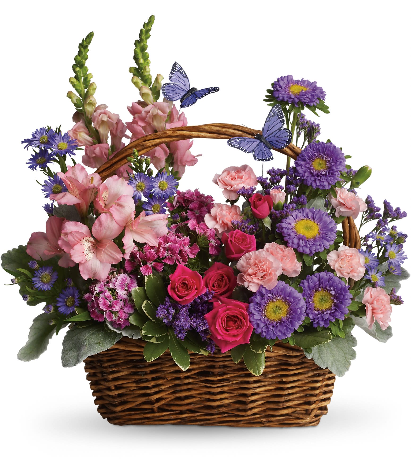 Basket arrangement of pink and purple flowers with butterfly picks