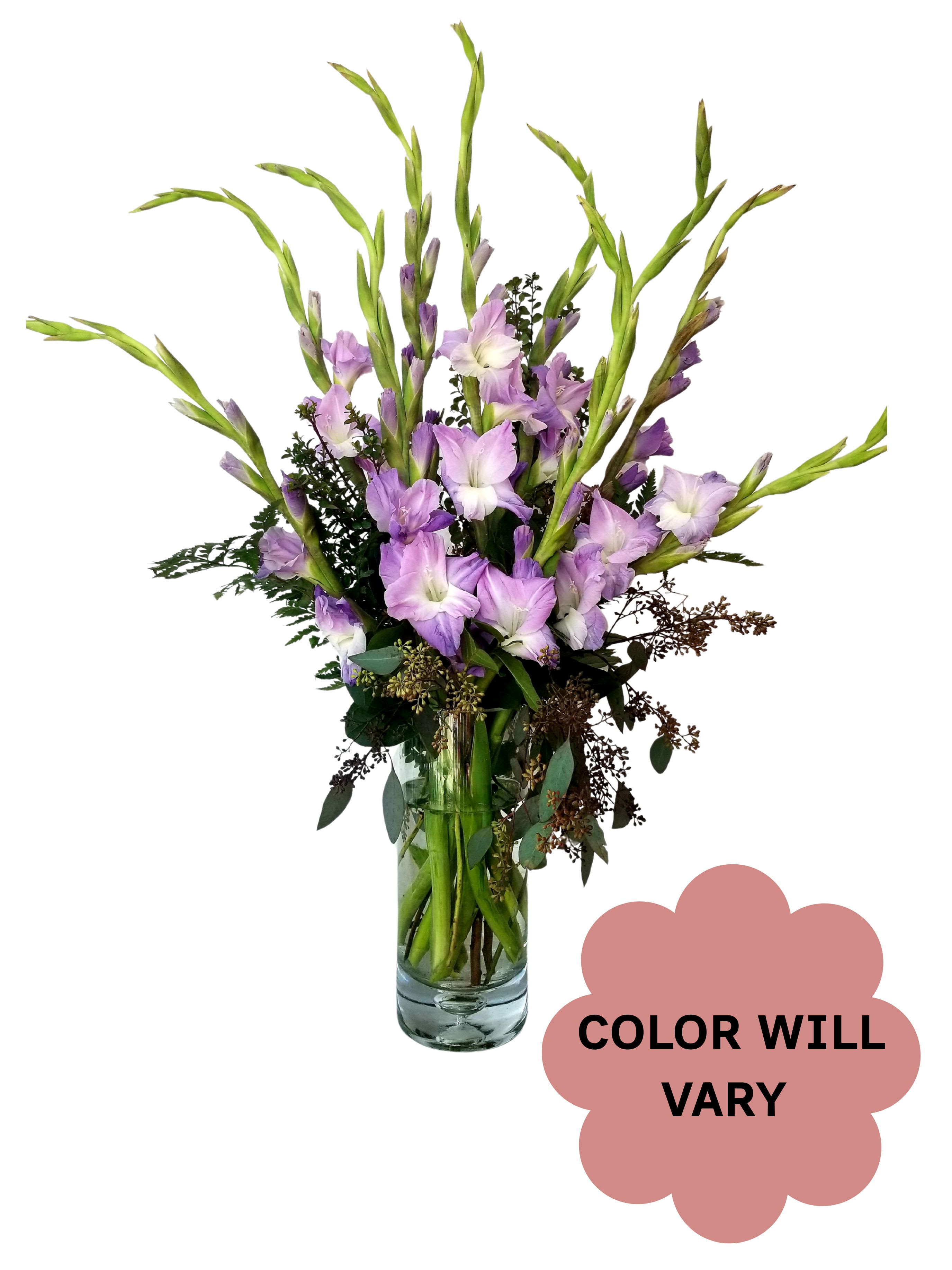 Tall lavender flower arrangement in a clear glass vase