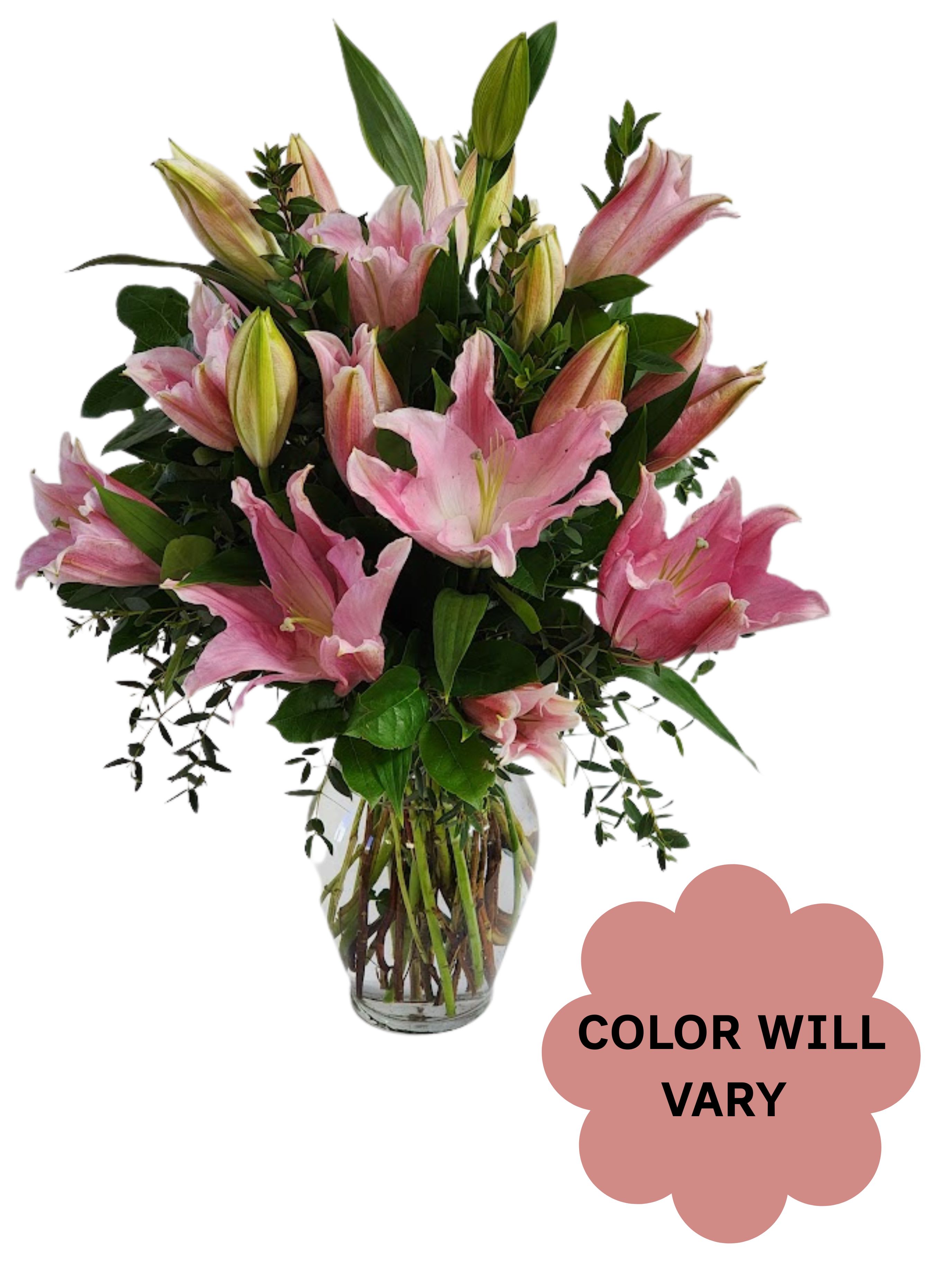 Pink lilies arranged in a clear glass vase