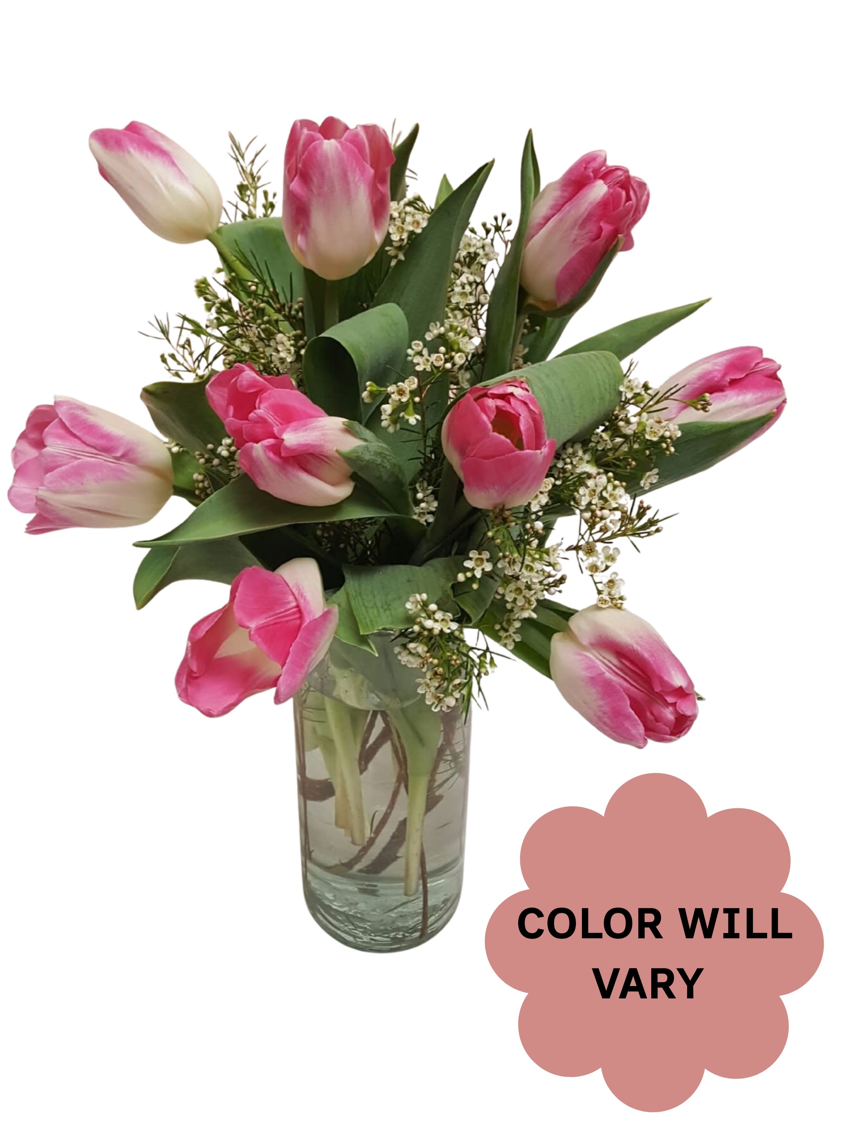 Pink tulips arranged in a clear glass vase