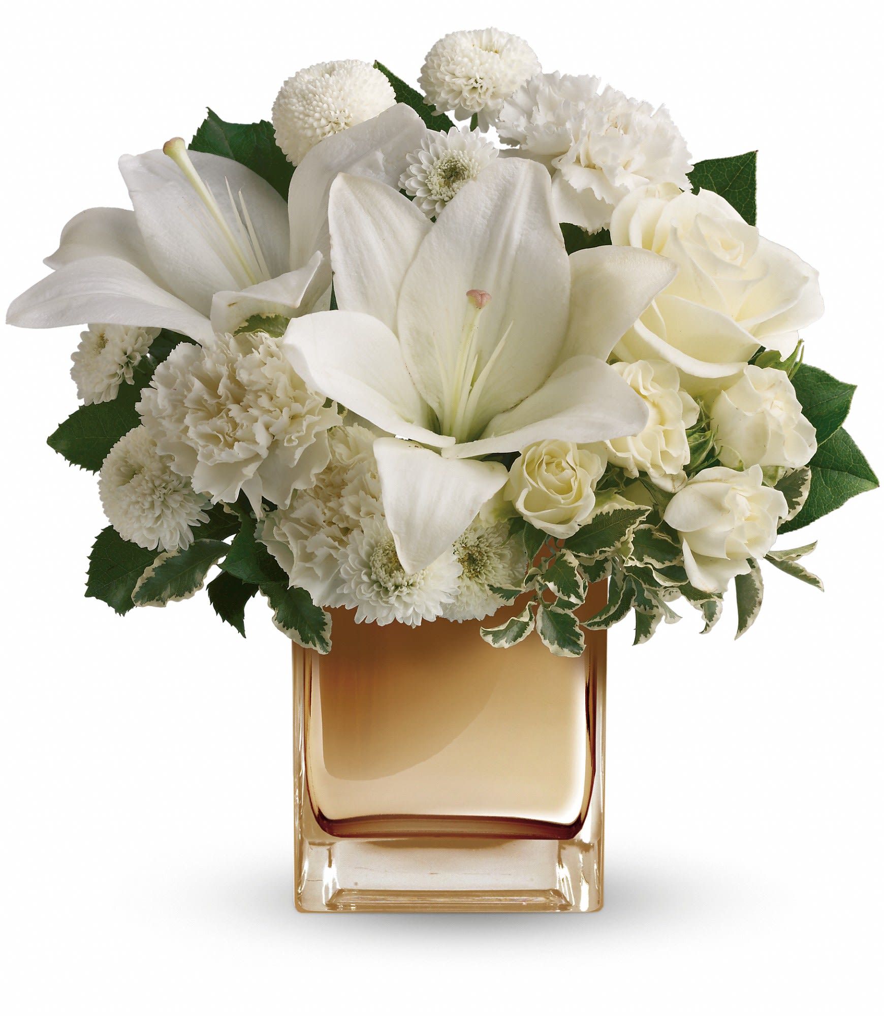 White lilies and roses arranged in a square glass vase