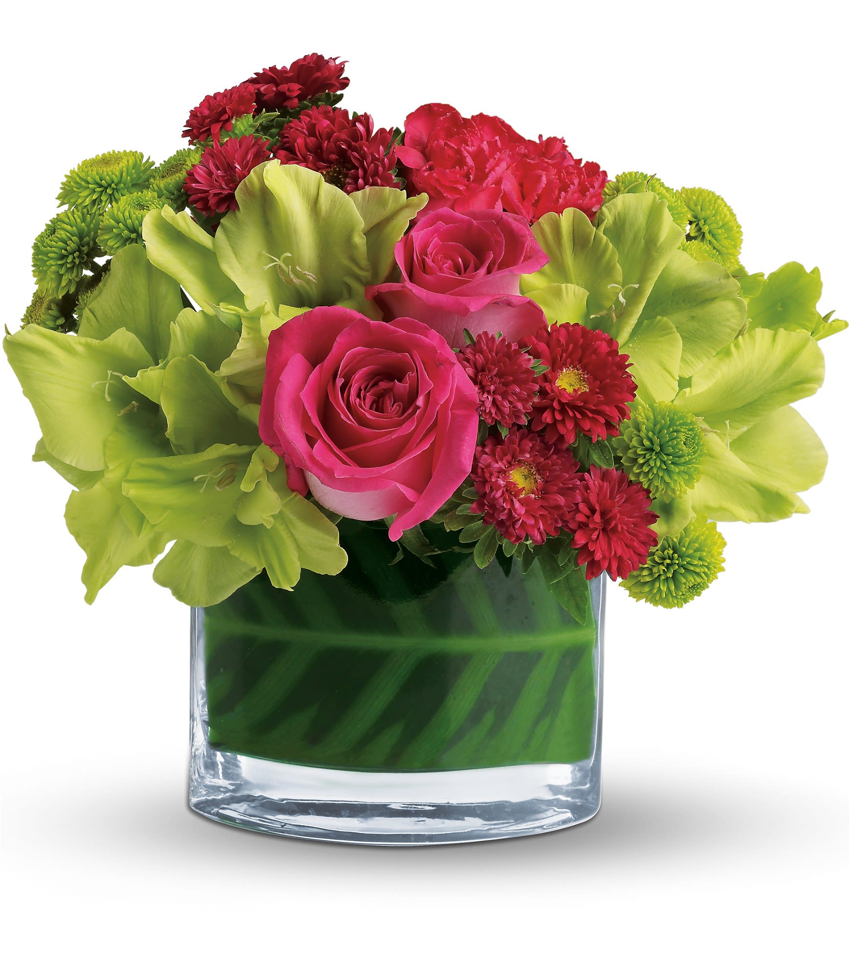 Pink roses and red flowers arranged in a clear glass vase