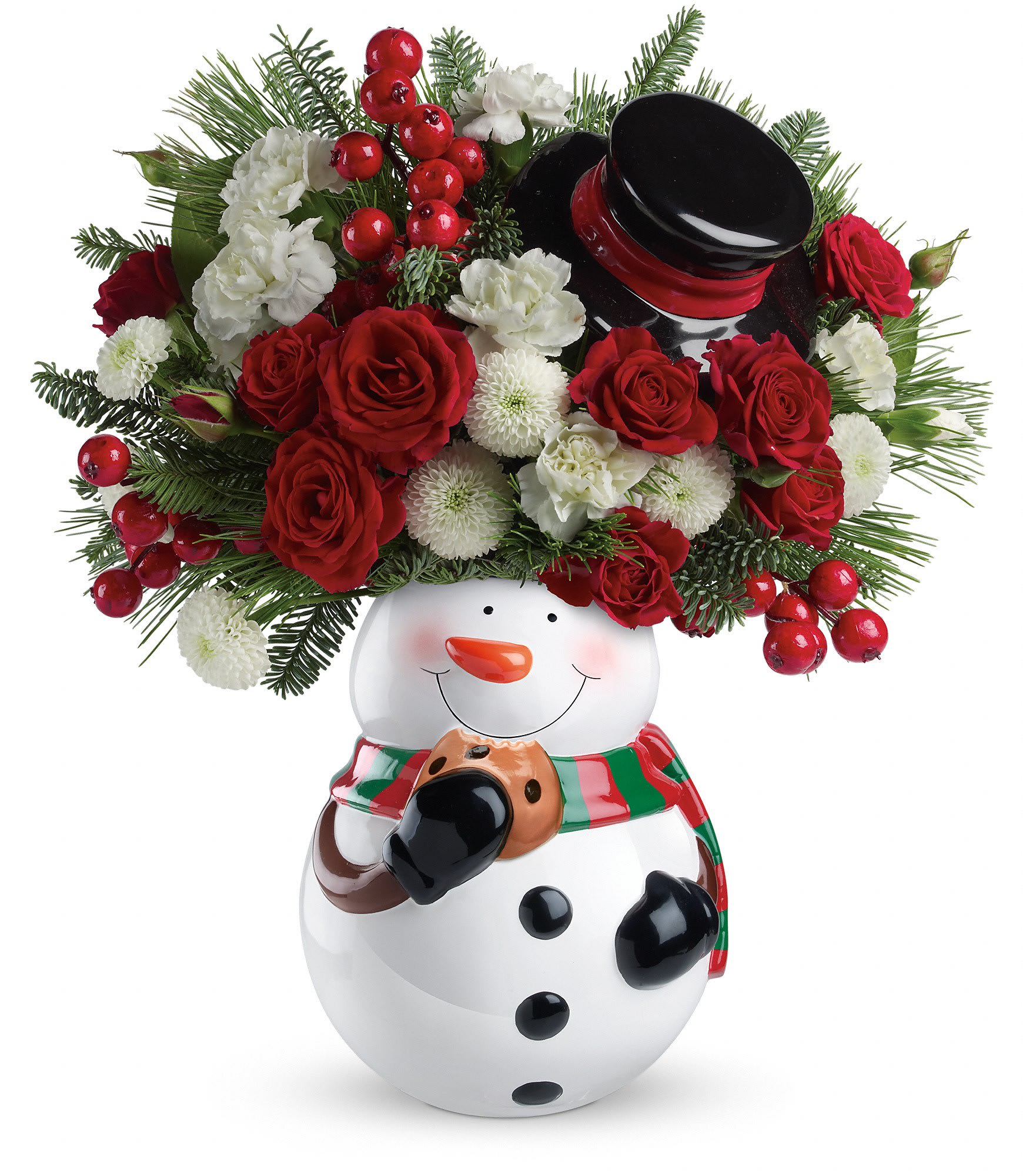 Red and white flower arrangement in a ceramic snowman container with evergreens and berries