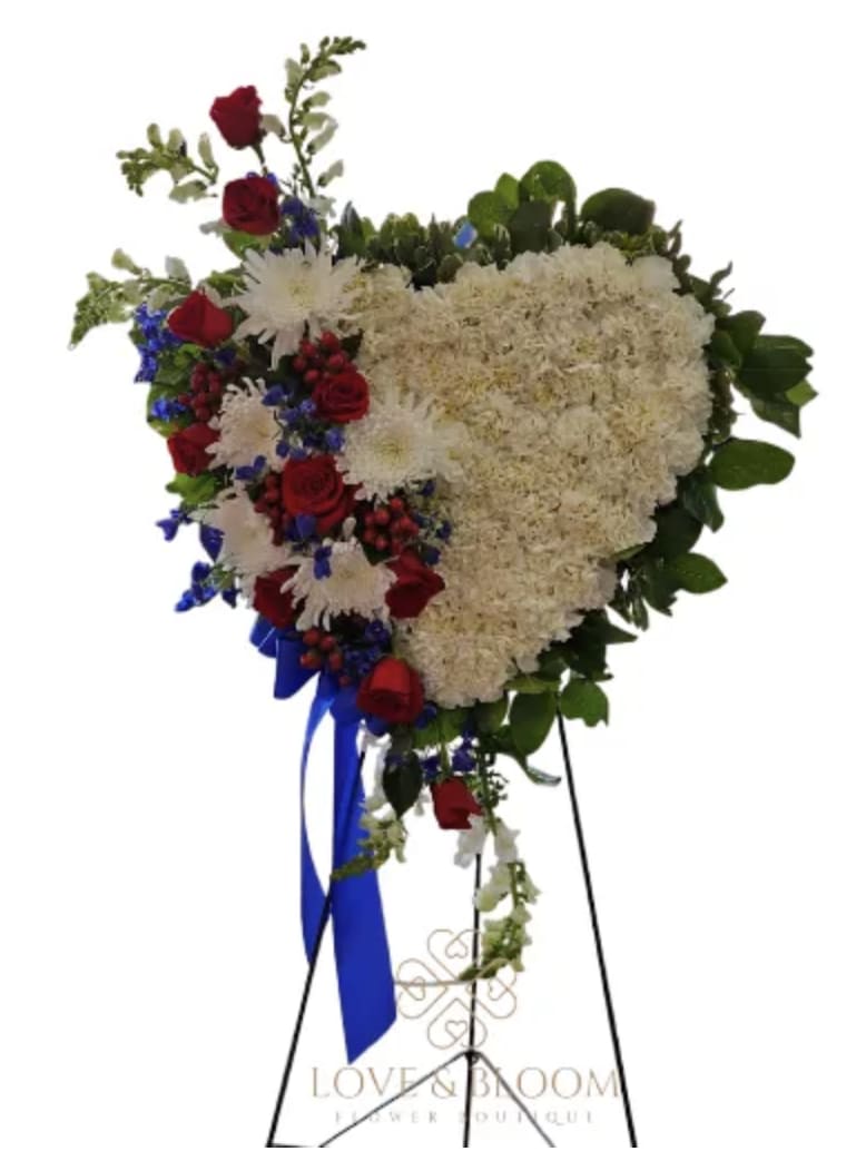 Heart-shaped floral standing spray with red roses and white blooms