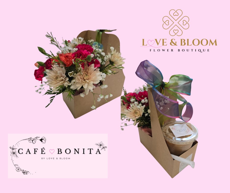 Kraft caddy holding pink and cream flowers beside an iced coffee cup with a multicolor ribbon bow.