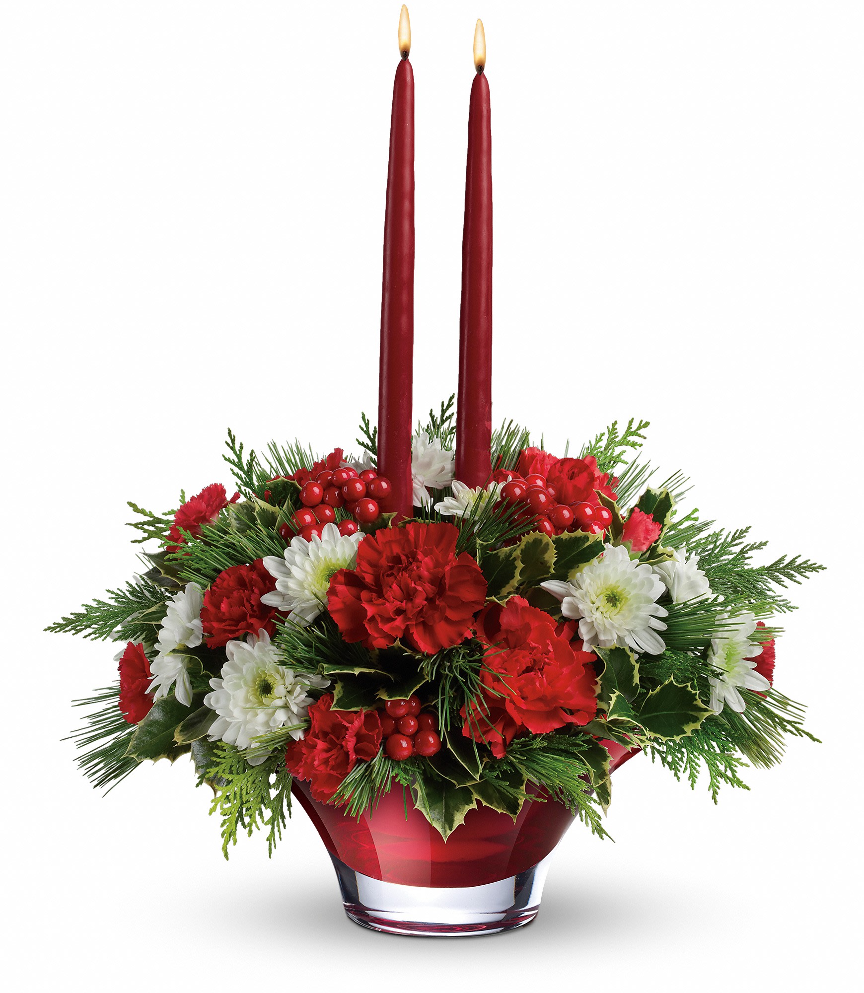 Red and white floral centerpiece with two tall red candles in a glass vase
