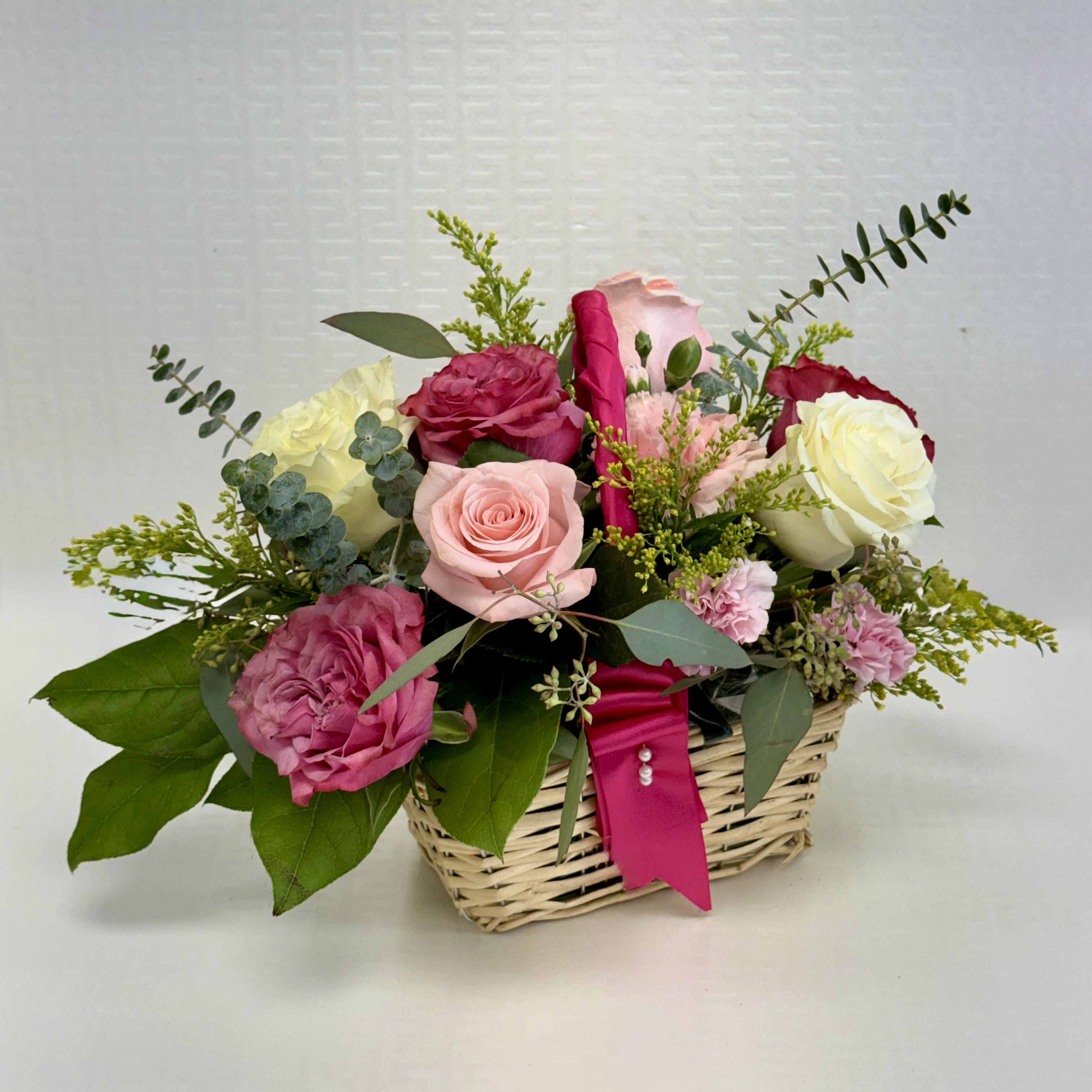 Sweet Love Garden - Soft pink and creamy white roses nestled with a seasonal greenery in a woven basket- perfect for valentine's Day or any heartfelt moment