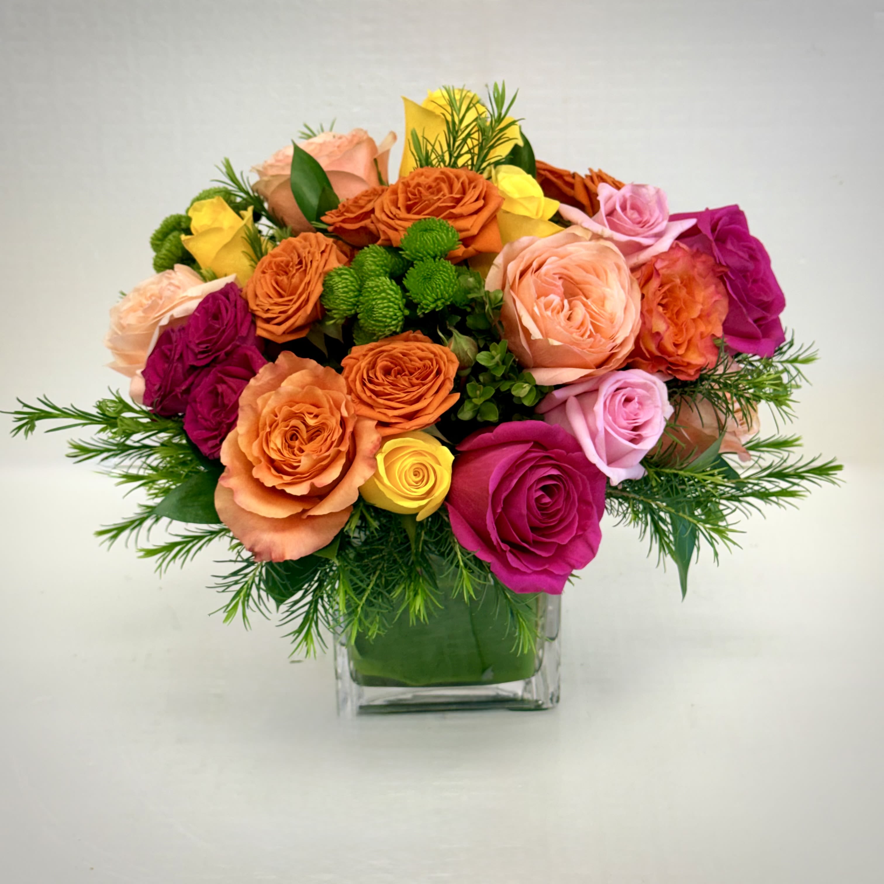 Sunshine Celebration Bouquet - A timeless mix of blush and coral roses with a soft, romantic feel that adds warmth and beauty to any setting. 