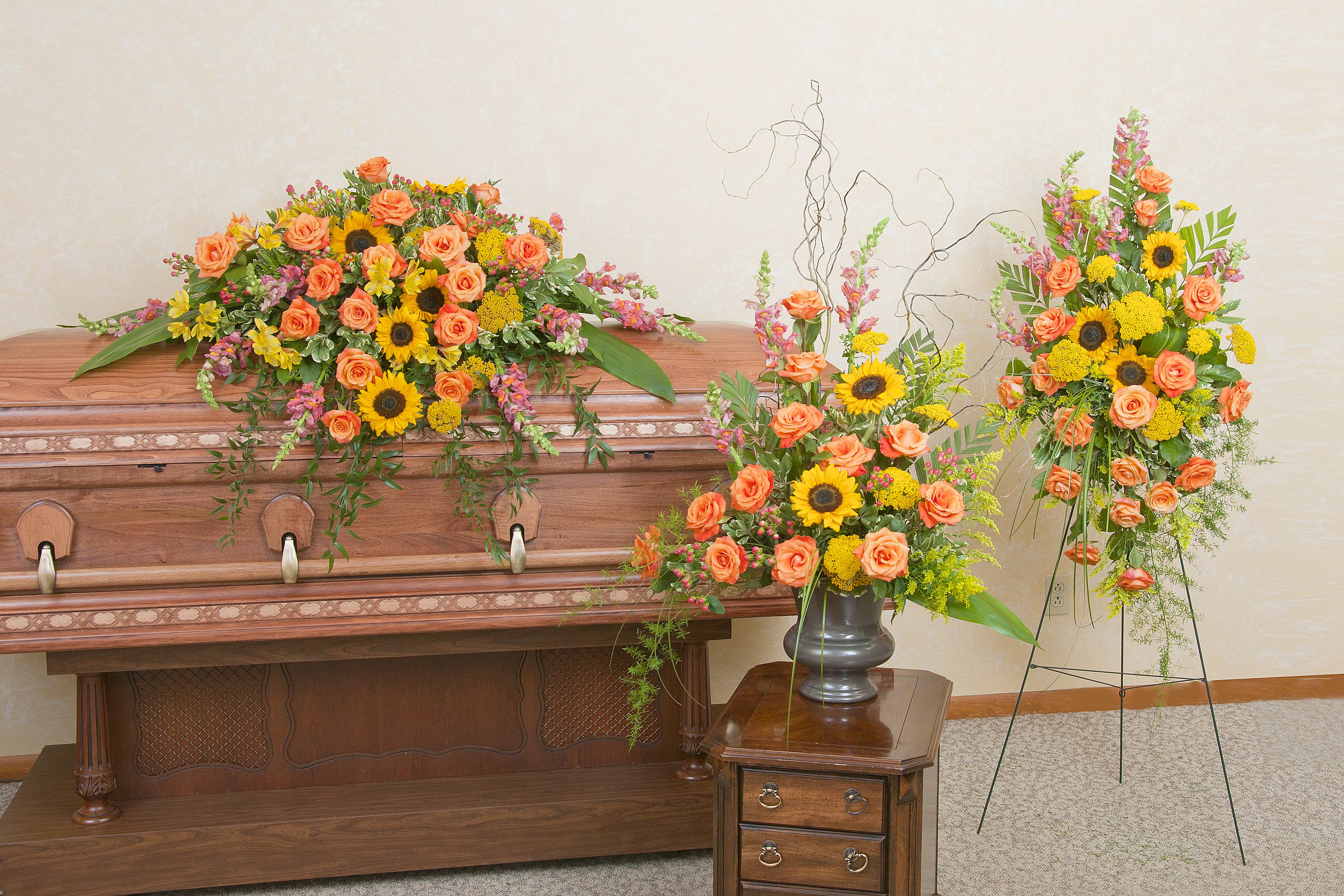 Heaven's Sunset Trio - Casket spray, standing spray and urn design in the beautiful colors of the sunset. As Shown : TMF-709