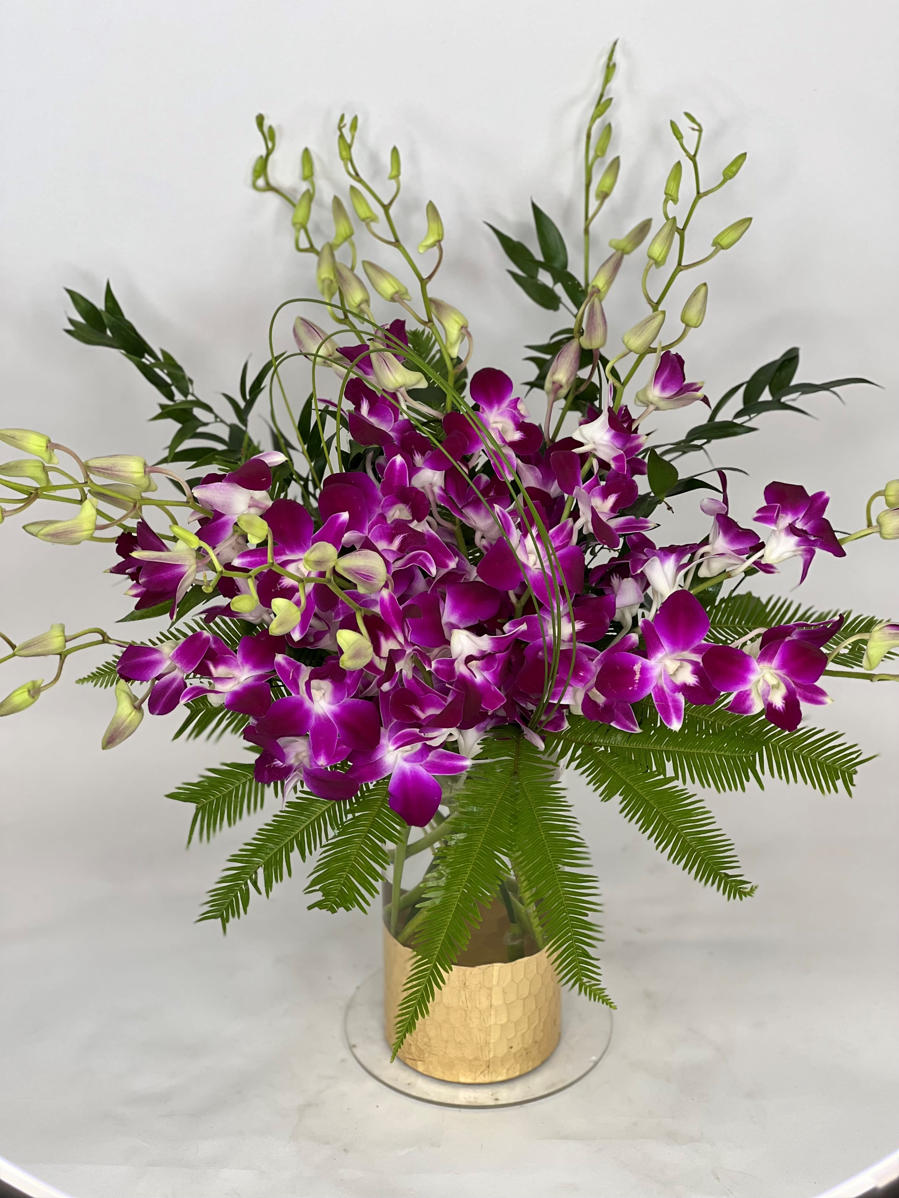 Dendrobium Bling  - A gorgeous arrangement of premium Dendrobium orchids with luscious greenery in an eye-catching BLING vase. 