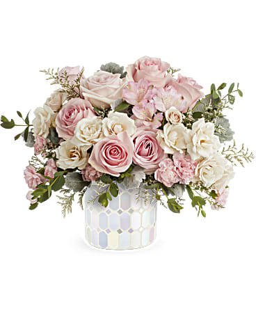 Rosy Skies Bouquet - This unique mosaic glass cylinder lends an organic feel to this extraordinary jewel-toned bouquet of light pink roses, crème spray roses, light pink alstroemeria, miniature pink carnations, and parvifolia eucalyptus. *Substitutions to flowers may be made but look and feel are always preserved.  Approx 16" w x 12" h  increases with version