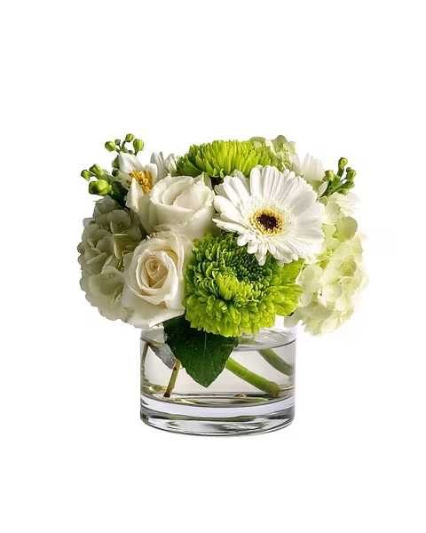 White and green flower arrangement in a clear glass vase