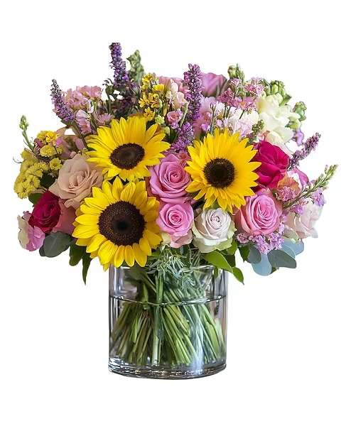 Pink Sunshine - A radiant bouquet bursting with joy, this arrangement features flowers like bright sunflowers and pink roses, softened by pastel accents and lush greenery