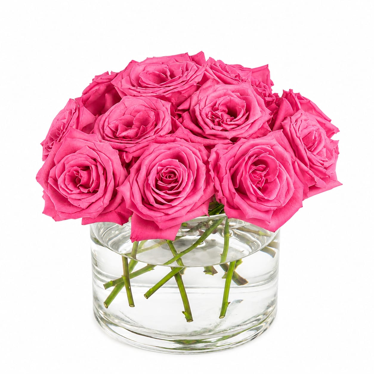 Pink roses arranged in a clear glass vase