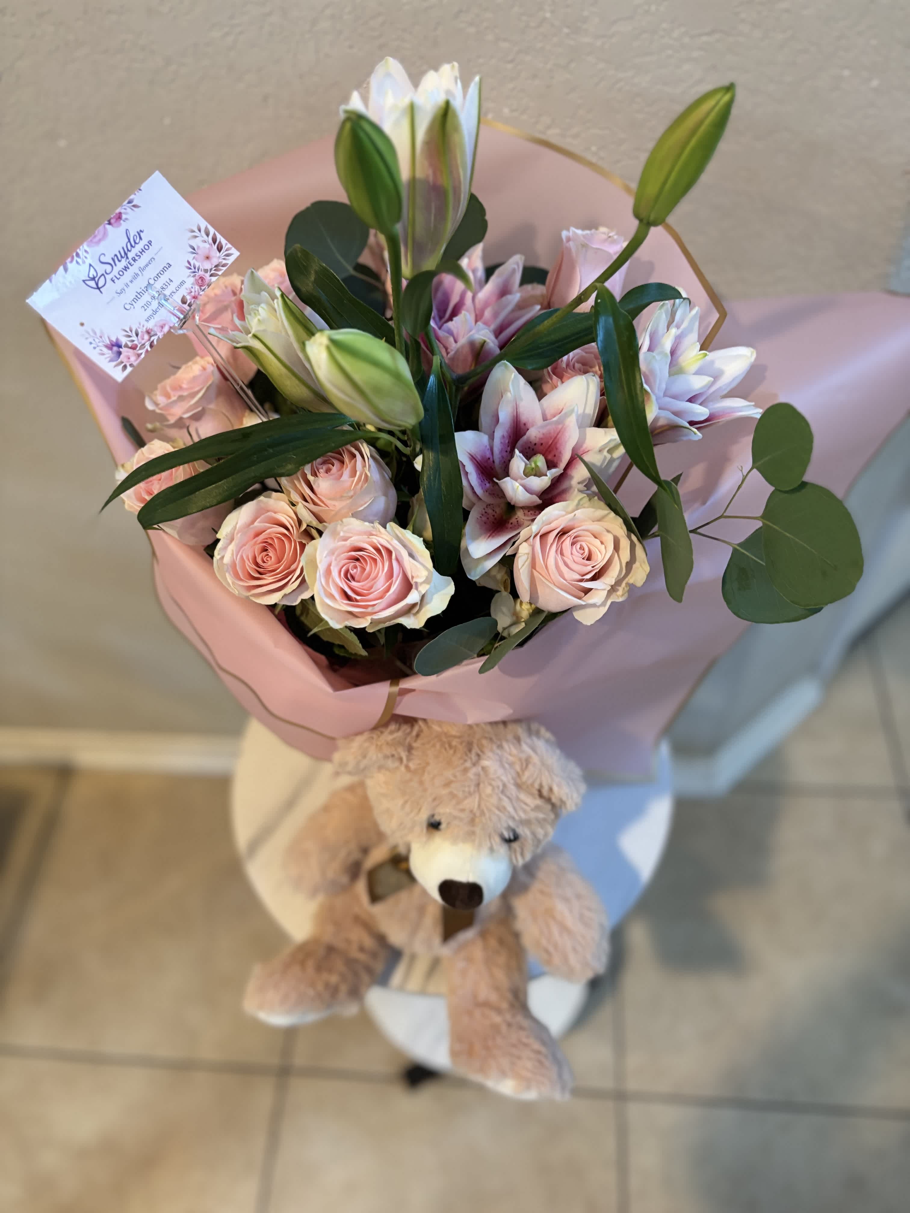 Pink rose and lily bouquet with a teddy bear attached