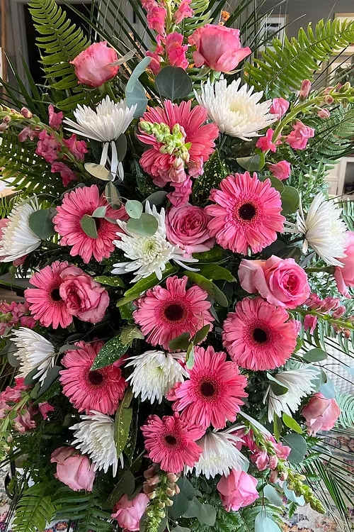 Pink and white mixed flower arrangement with gerbera daisies and roses