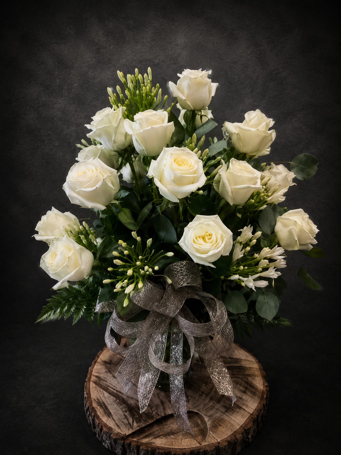 20th Anniversary - Let's celebrate any occasion with 20 white roses intricately arranged with white filler and greenery.