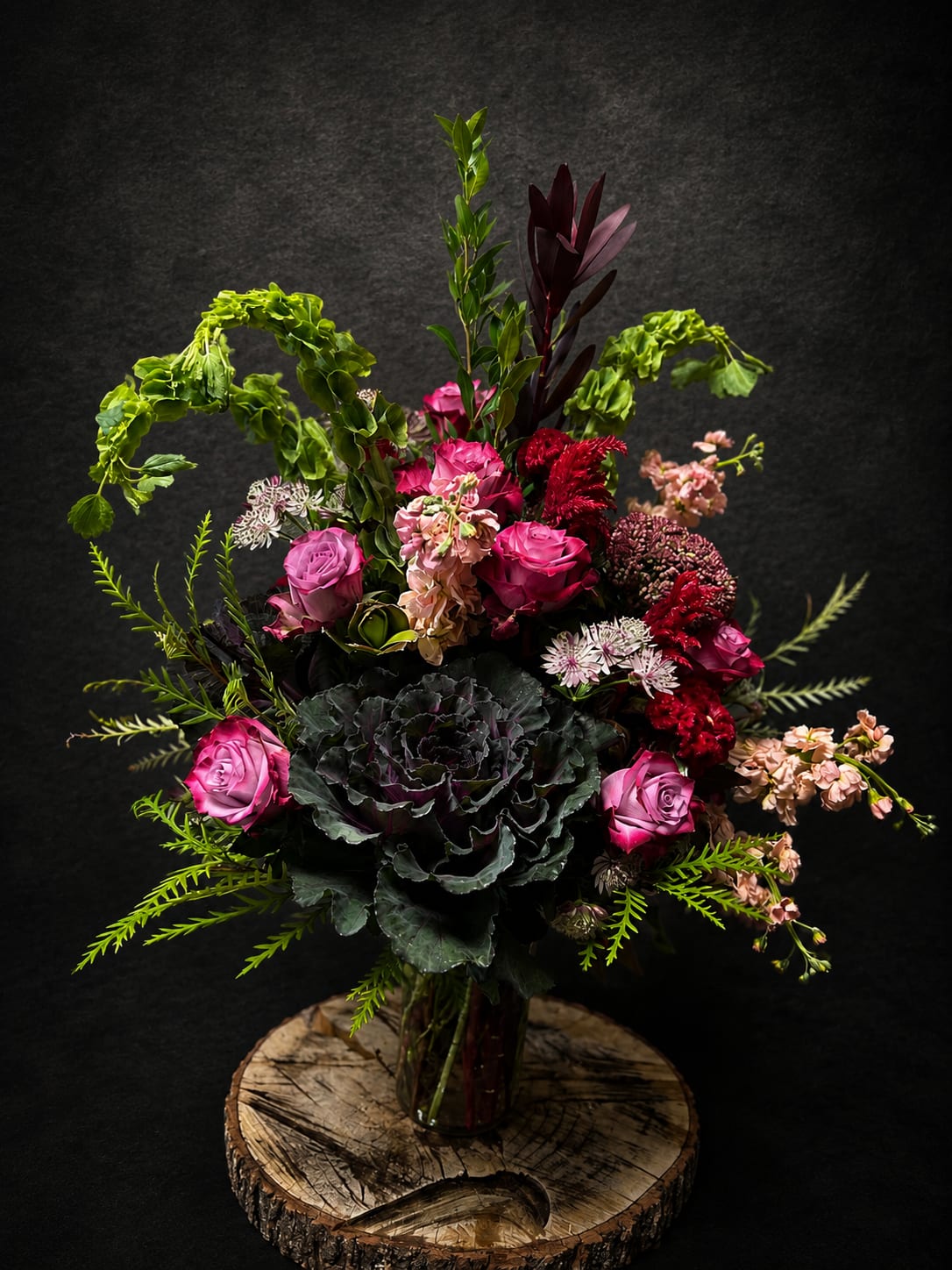 Midnight Magic - An arrangement with a modern twist of flowers intricately arranged for any occasion. 