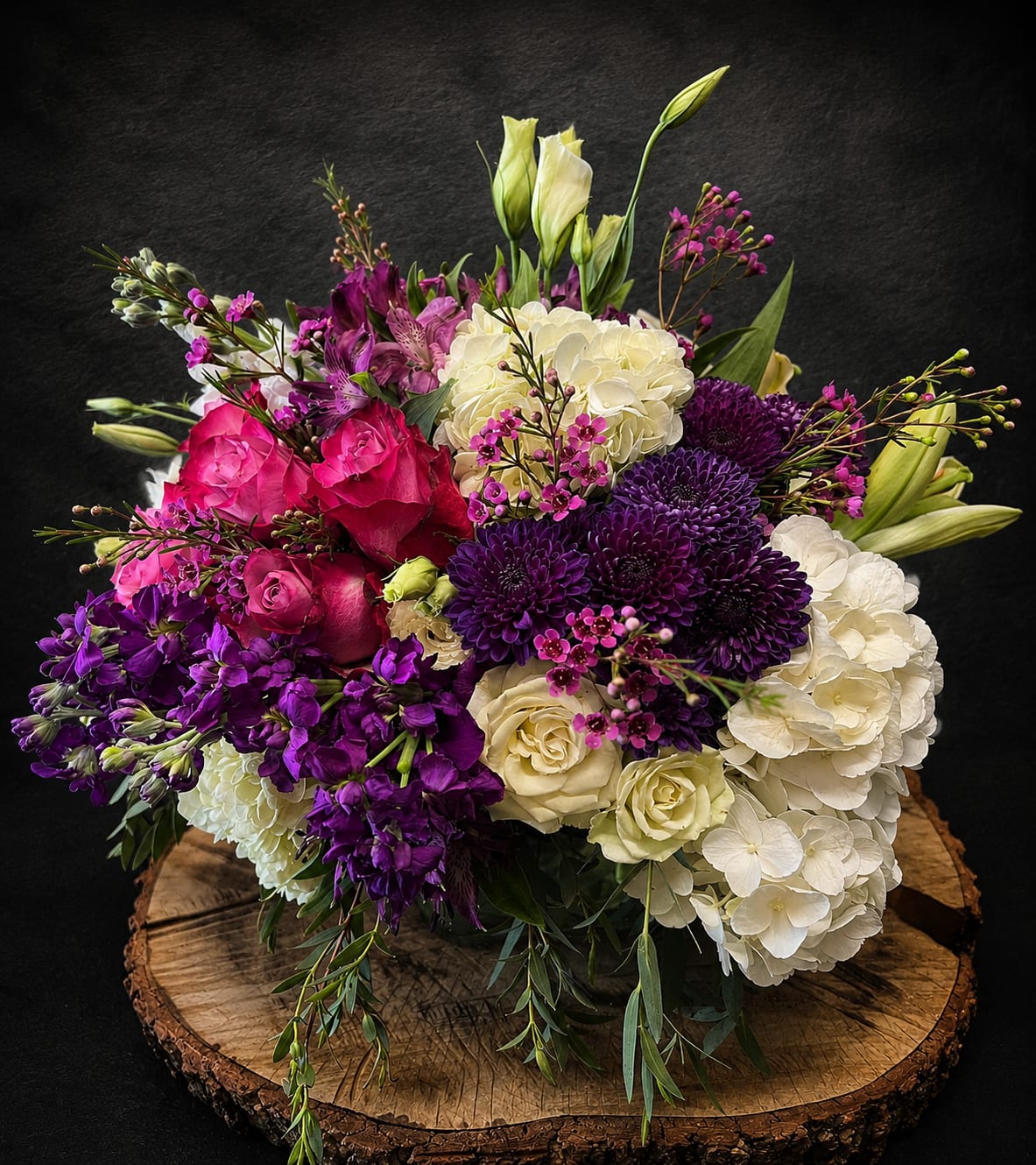 Purple Passion - A low luxurious vase arrangement for those that love the color purple and pops of white. Can be sent for any occasion!