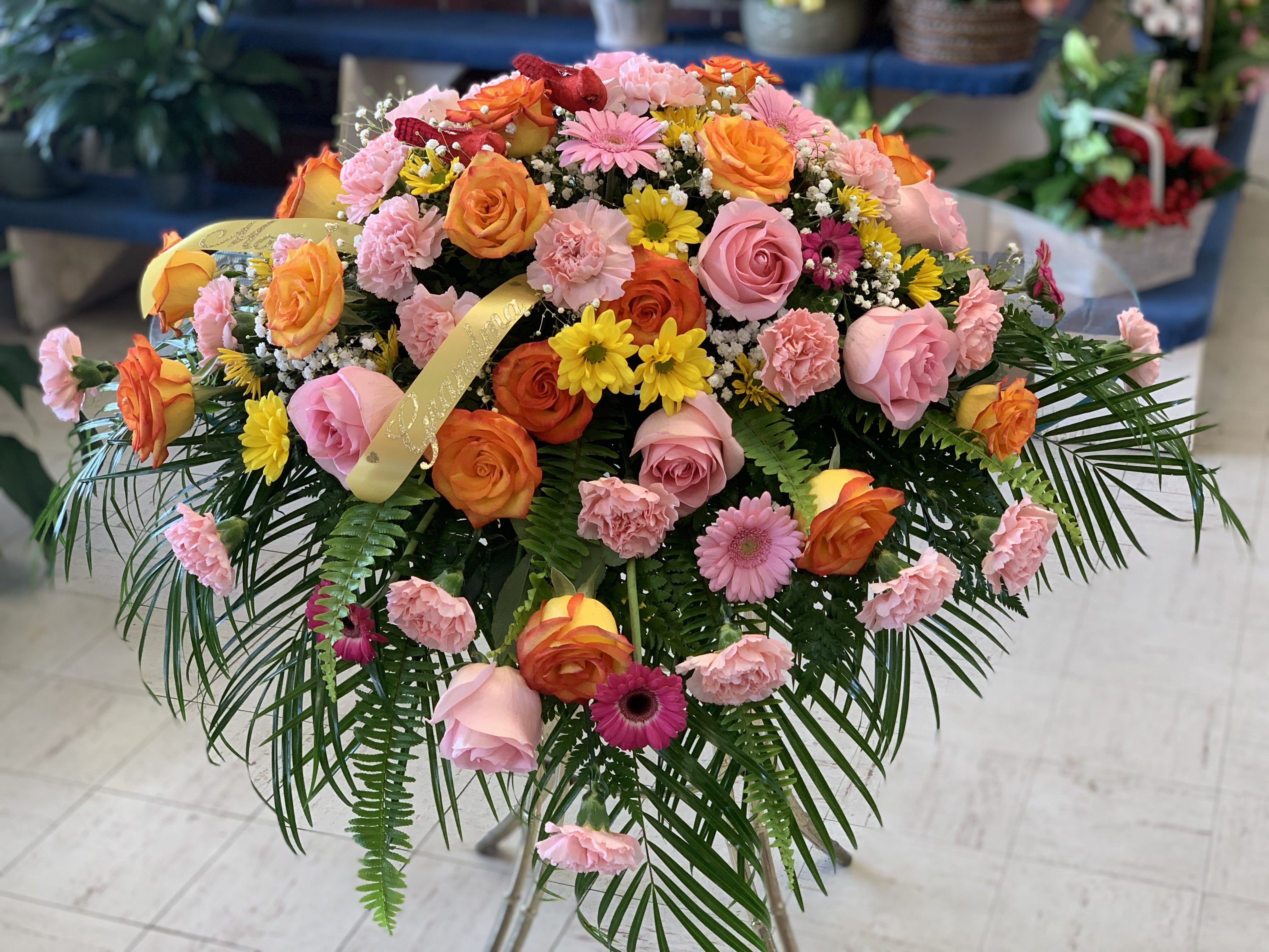 Large mixed bouquet of pink, orange, and yellow flowers