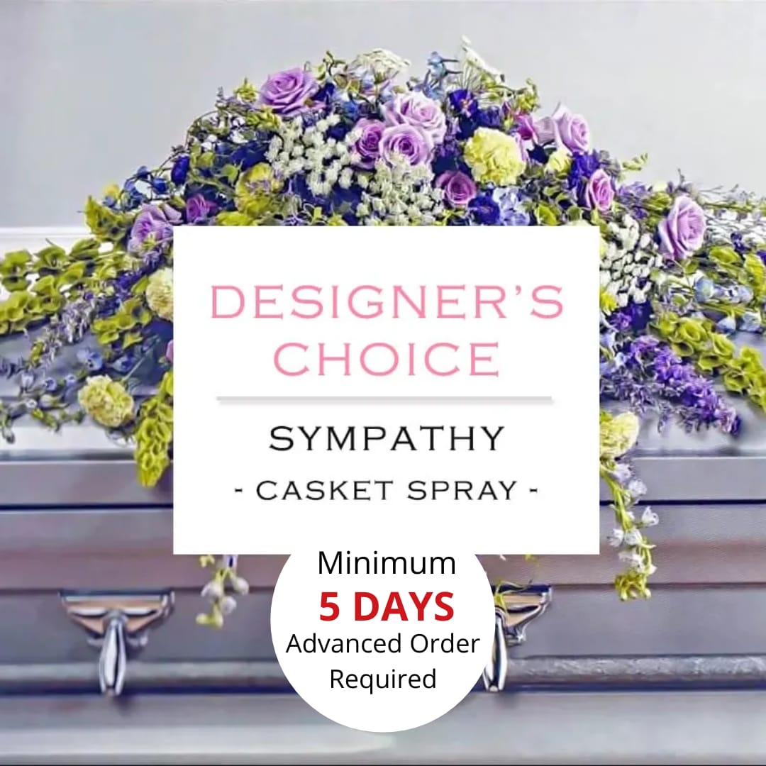 Purple, yellow, and white sympathy casket spray on a silver casket