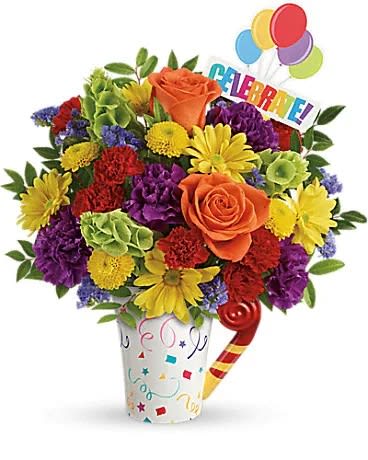 Colorful bouquet in a decorated vase with balloons and a celebration sign