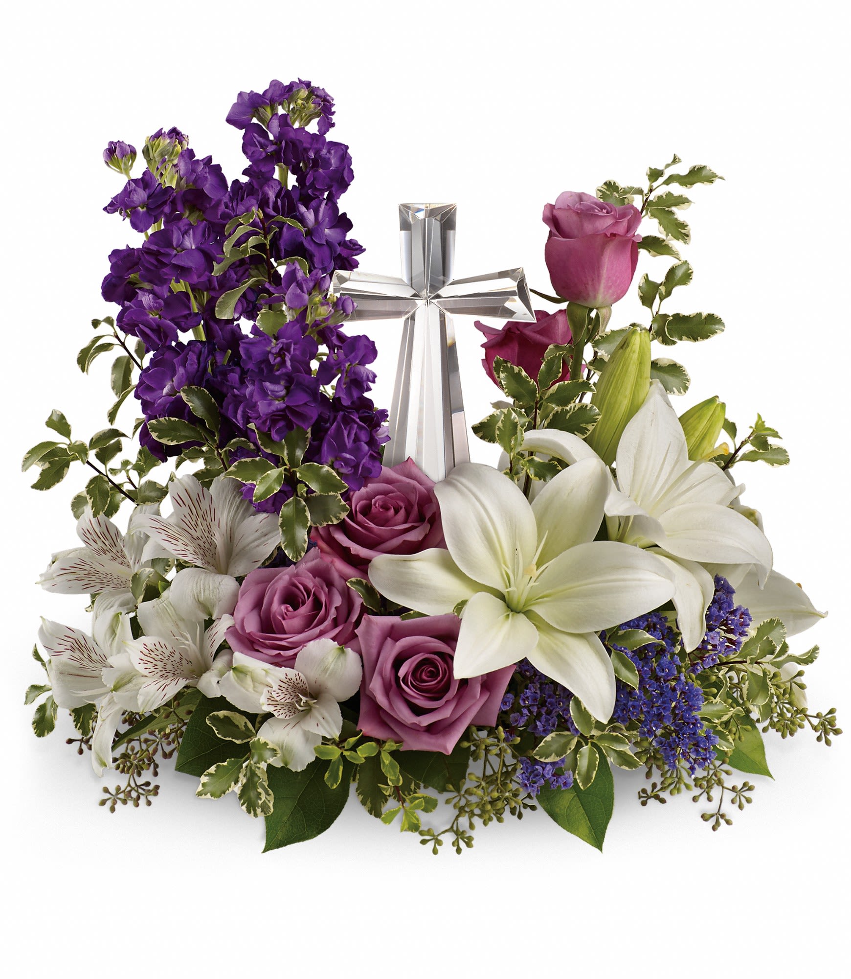Purple and white floral arrangement with a silver cross centerpiece