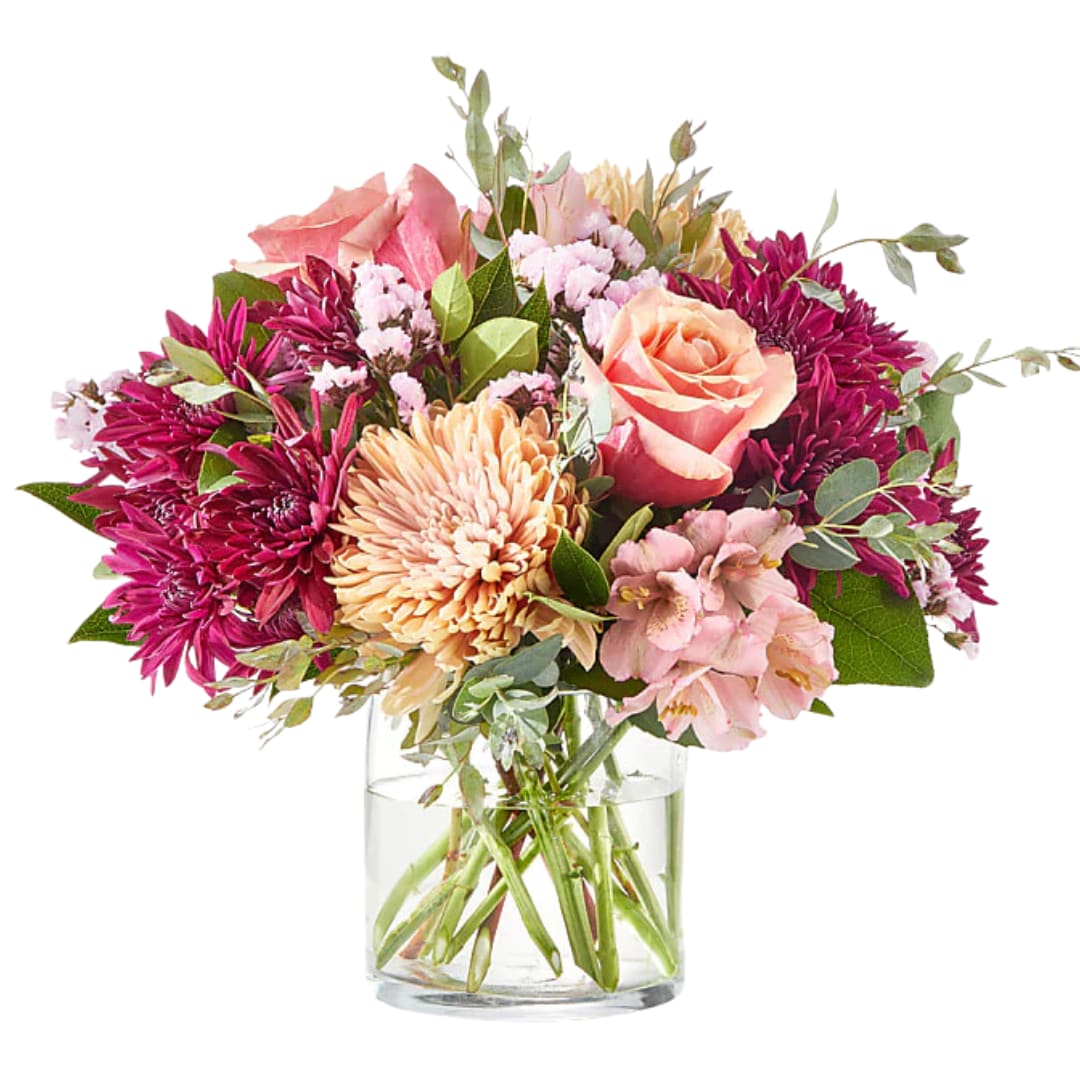 Pink and peach mixed bouquet in a clear glass vase
