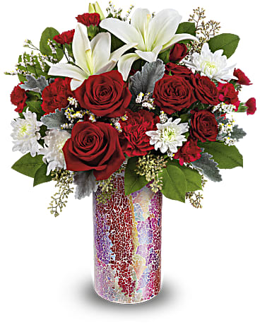 Red roses and white lilies in a colorful mosaic vase