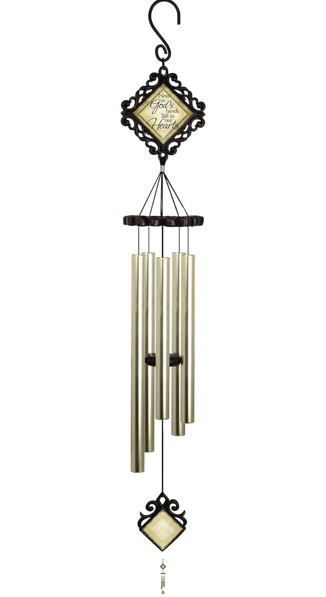 Decorative wind chime with a framed memorial message and metal tubes
