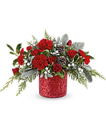 Red roses and carnations in a glittery red vase with pinecones