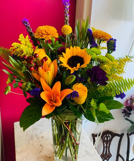 Longing for Fall - Even though it's still hot out the fall flowers are beginning to roll in! Stayed tuned for more fall arrangements. This one features mums, roses, sunflowers, liatris and a whole bunch more!