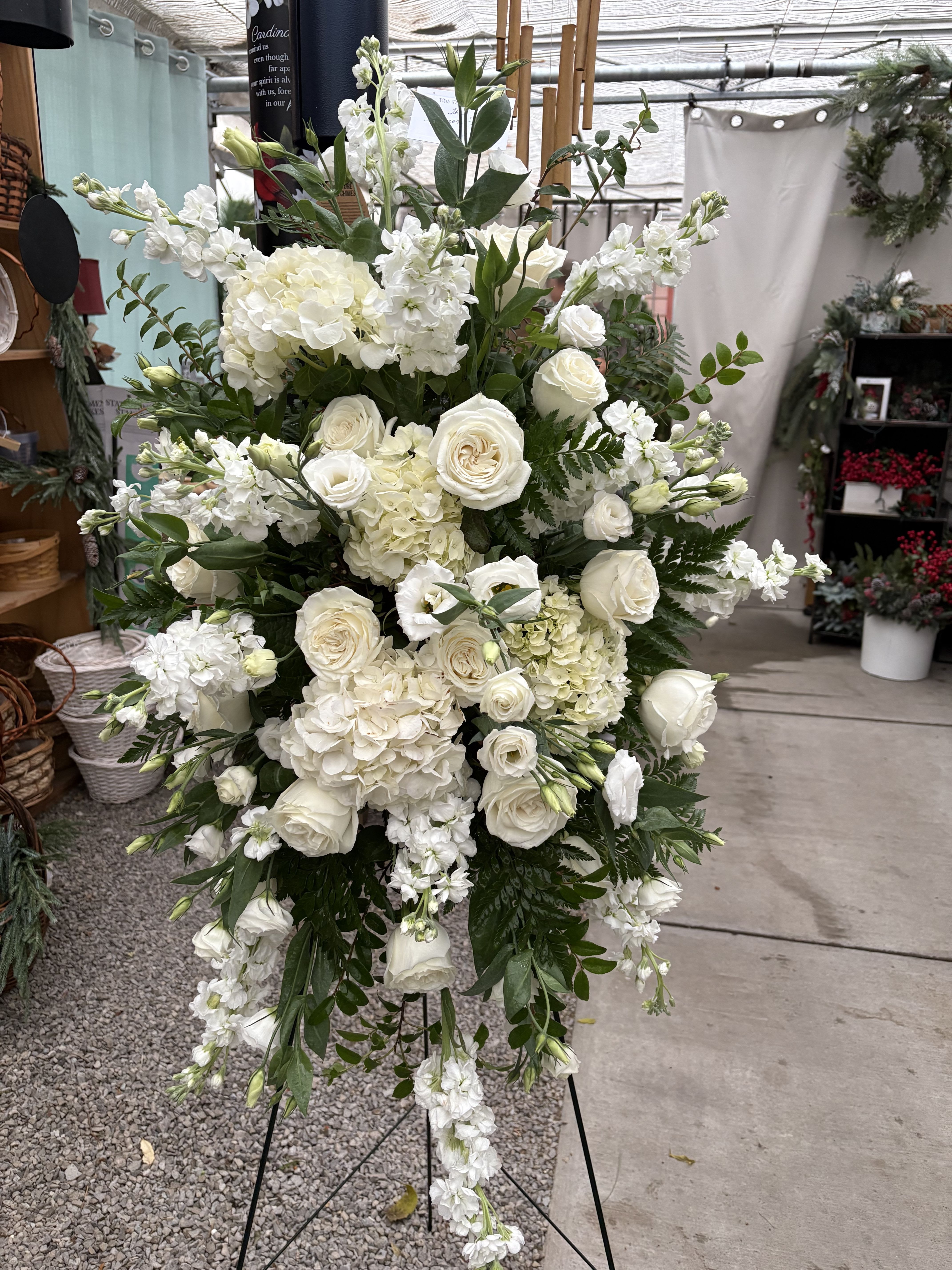 WISTFUL ELEGANCE FUNERAL EASEL - An elegant funeral piece with delicate whites and creams to show grace and remorse for the loss of passed loved ones