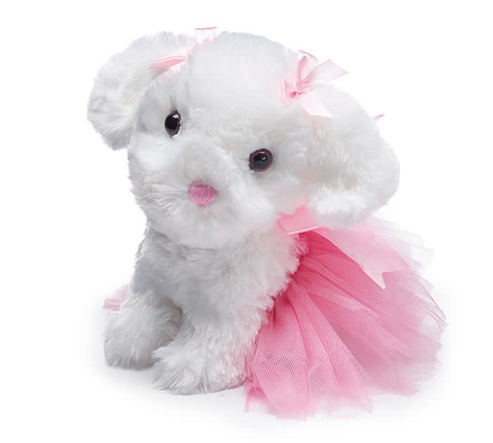 White plush puppy wearing a pink tulle dress and bow