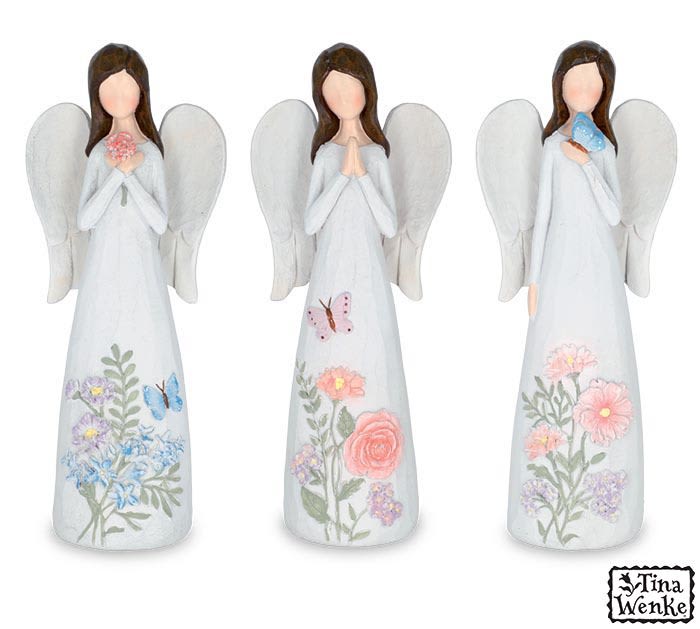 Three angel figurines with floral designs and butterflies