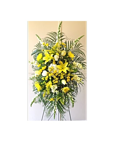 Tall yellow floral standing spray on a black easel