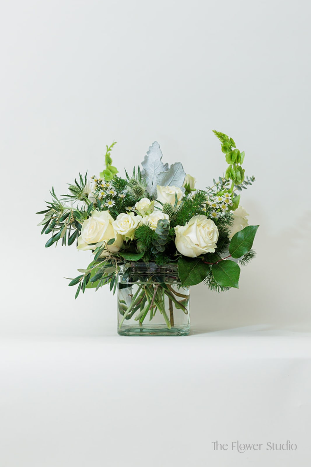 Lace - This modern and elegant white flower arrangement, it's perfect for a office, or centerpiece at home, to give a good and fresh vibe. Our artists hand-design each arrangement, so Flowers &amp; Containers colors and style may vary due to local availability therefore we are unable to fulfill any requests for specific florals, colors, or containers/vessels.