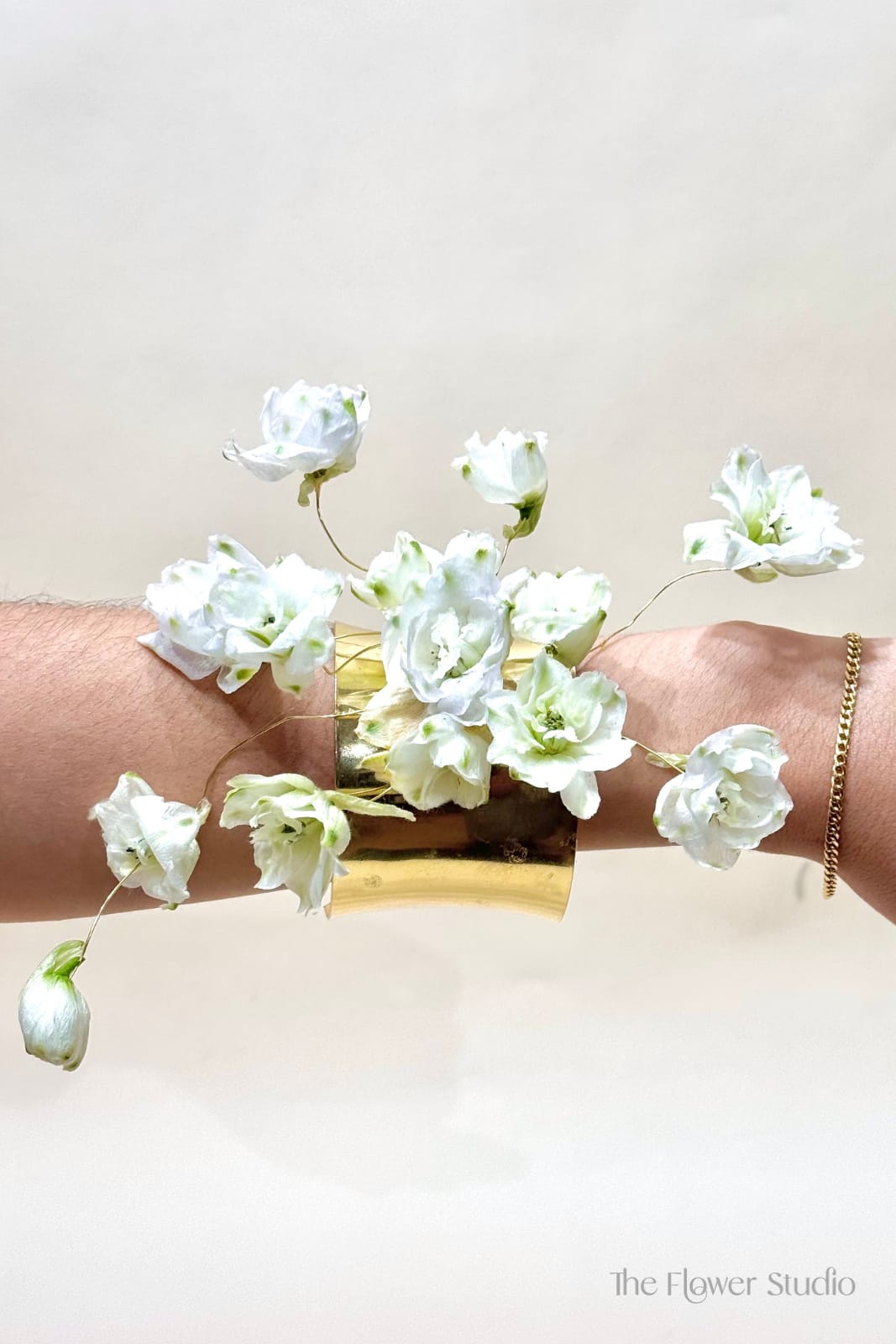 Wire frame cuff Corsage - A luxurious wire-frame cuff adorned exclusively with premium blooms, creating a floral accessory that feels more like fine jewelry than a traditional corsage. Elegant, modern, and exquisitely refined. Pricing varies based on flower selection and seasonal availability.
