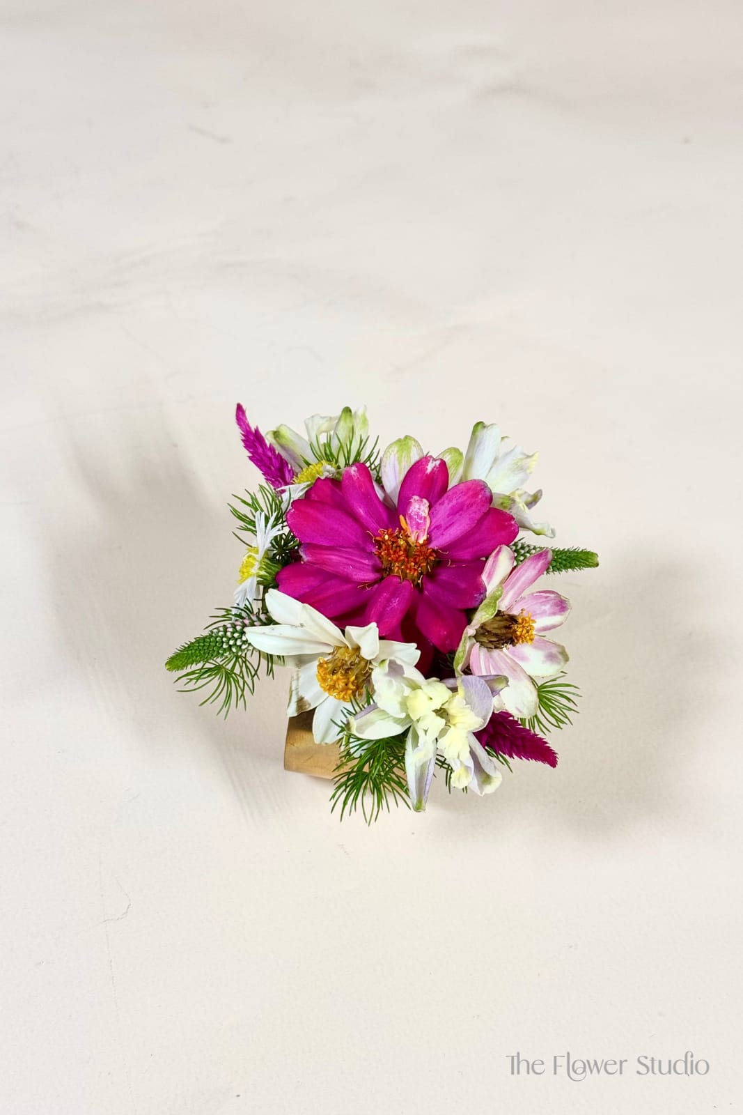 Cuff Corsage - Add a touch of elegance to any occasion with our corsage designed on a stylish cuff. Available in both gold and silver, this wearable floral piece is perfect for weddings, graduations, proms, or any special celebration. The floral colors are fully customizable to match your outfit, theme, or event palette. A timeless accessory that brings an extra floral touch and makes every moment feel even more special.
