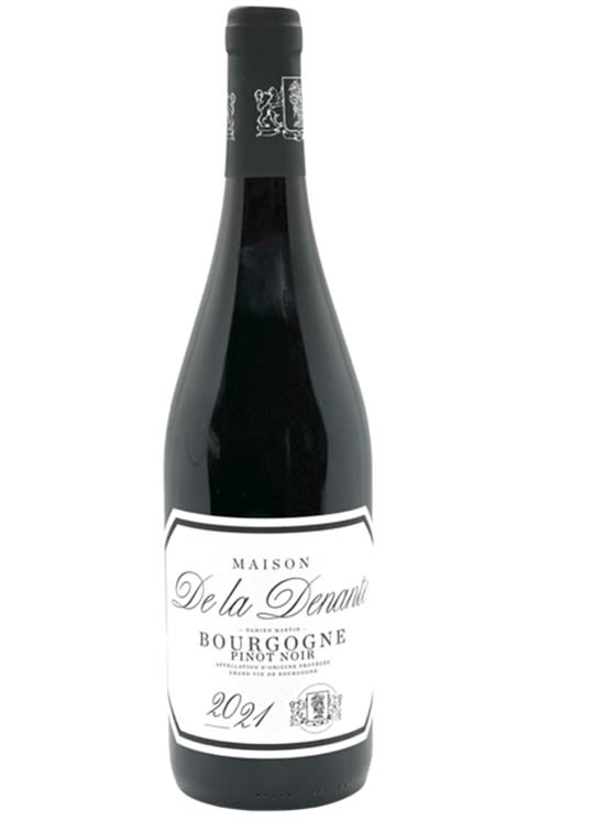 Bottle of red wine with a white label
